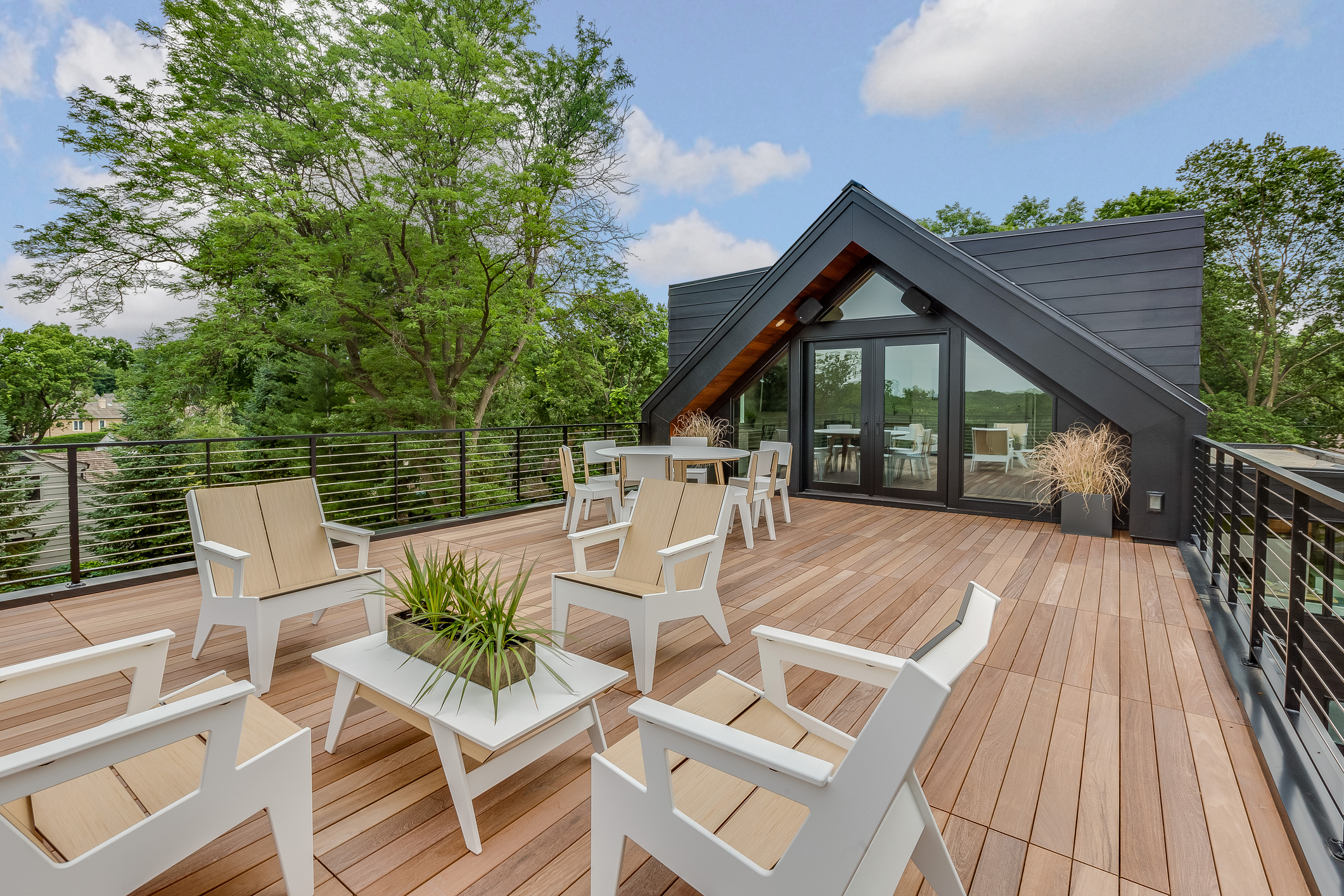 Modern deck construction with natural wood by DMV Home Improvement